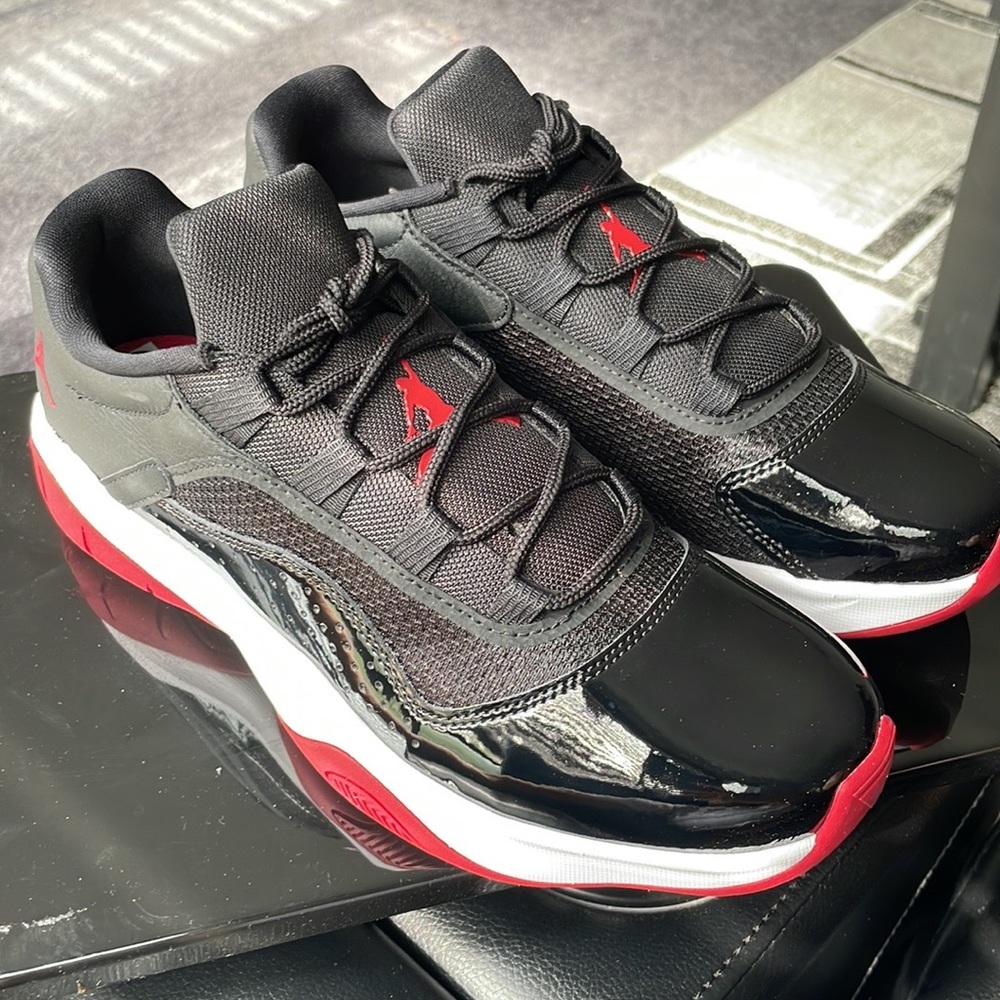 Jordan 11s Low… size 8.5 red black and white